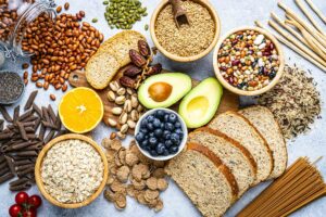 a variety of healthy foods including nuts, berries, whole wheat breads
