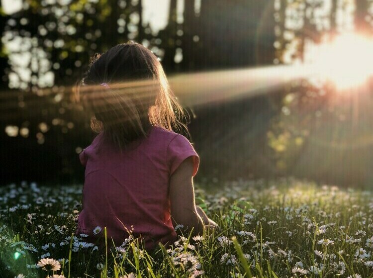 child immersed in the present moment in nature